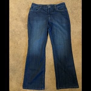 Slightly distressed, dark wash, slightly stretchy.